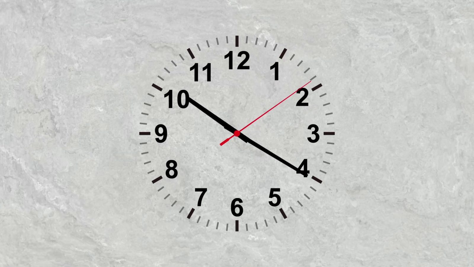 A plain analogue clock face with black numbers and a red second hand on a light grey stone background